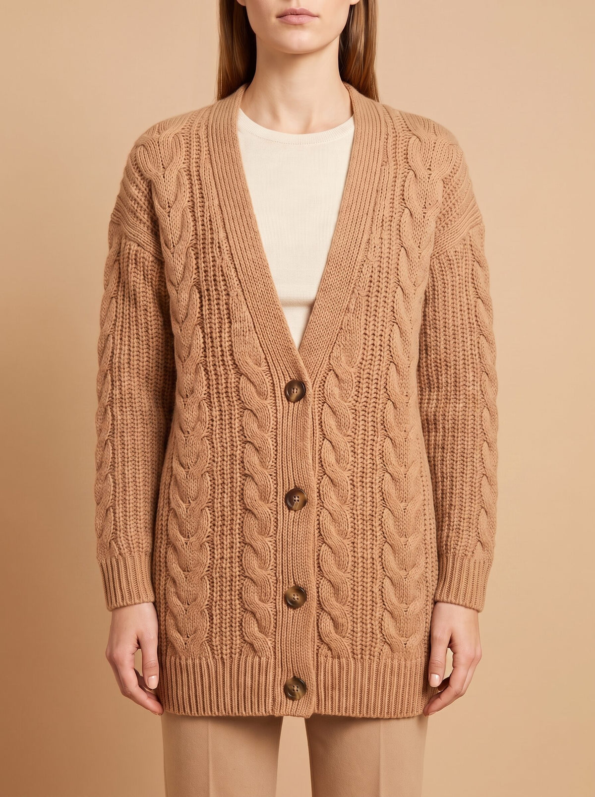 Women's chunky cable knit cardigan in camel, front close view