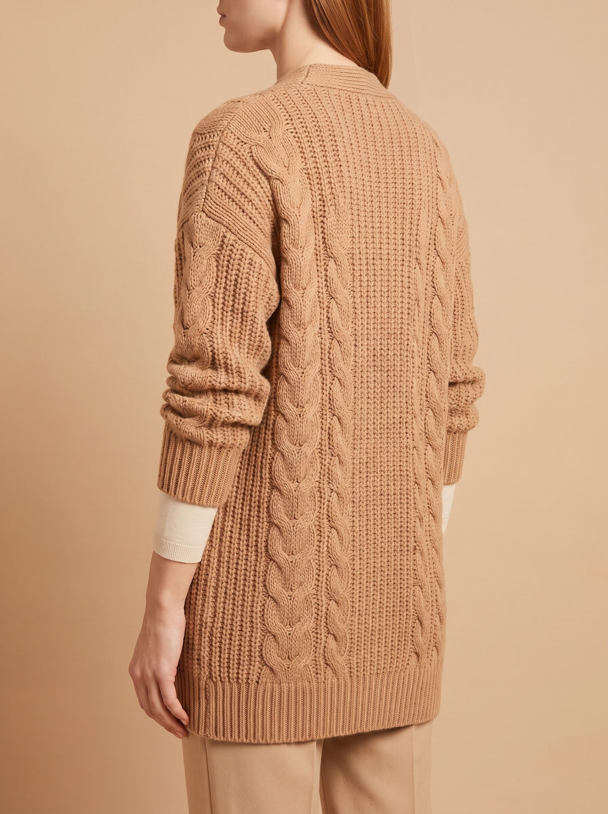Women's chunky cable knit cardigan in camel, back view