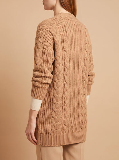 Women's chunky cable knit cardigan in camel, back view