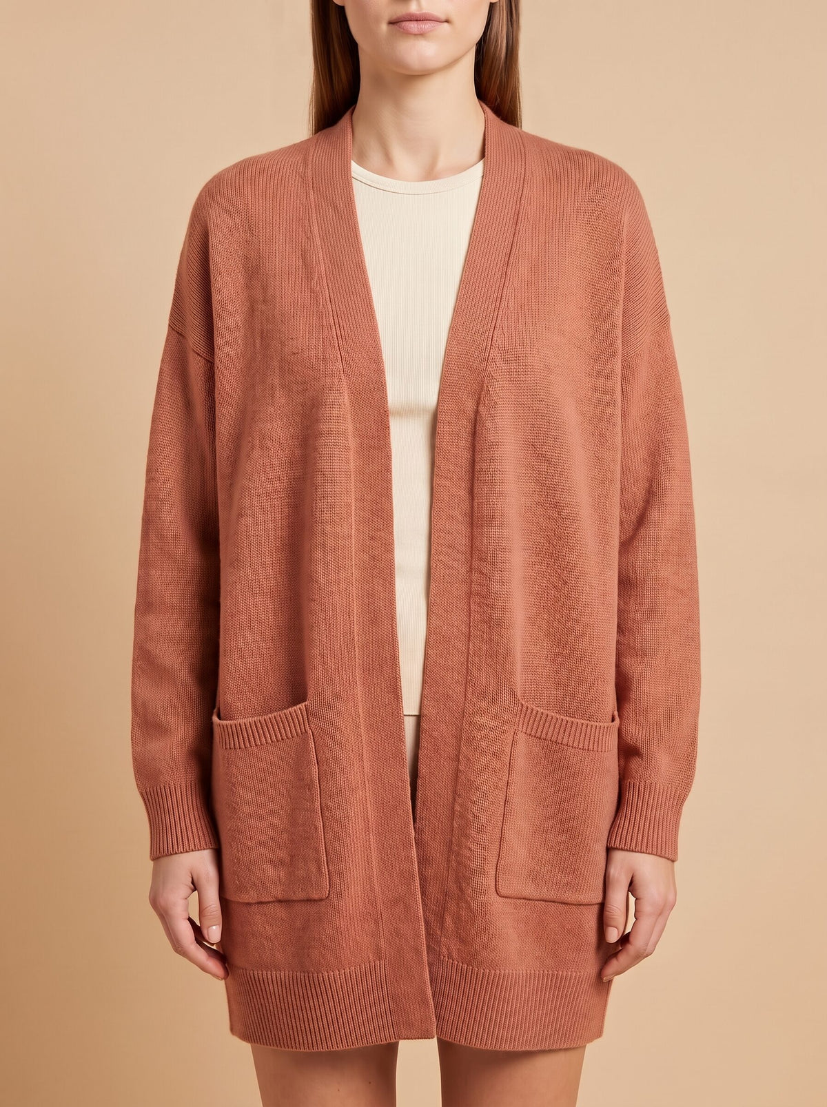 Women's oversized cardigan with pockets in rust, front close view