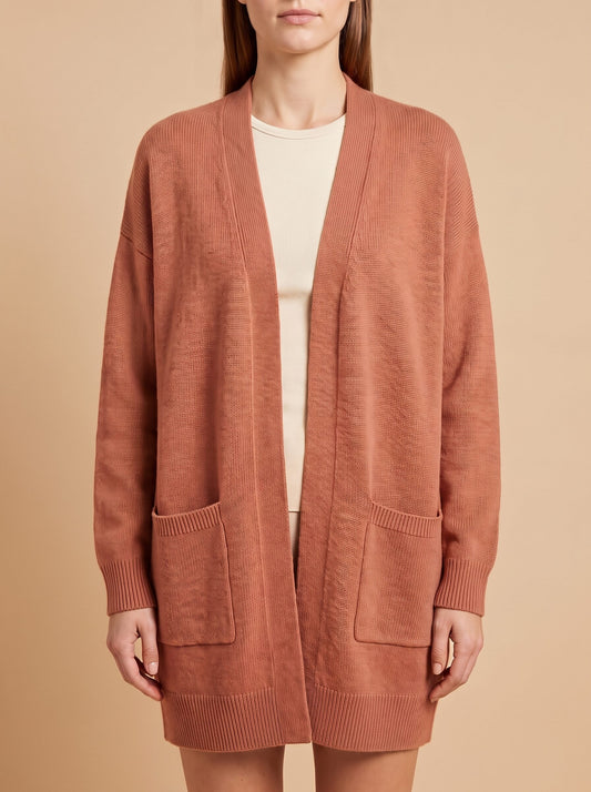Women's oversized cardigan with pockets in rust, front close view