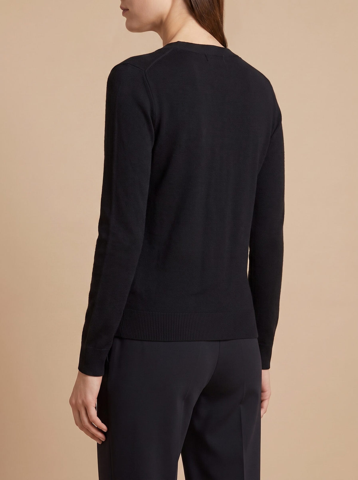 Women's V-neck button front cardigan in black, back view