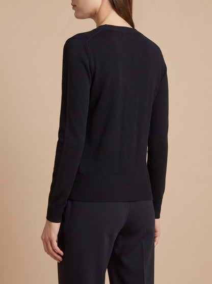 Women's V-neck button front cardigan in black, back view