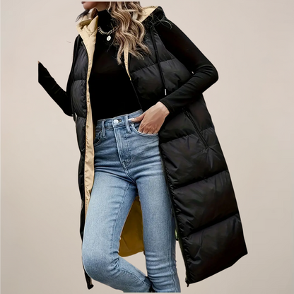 https://cdn.shopify.com/s/files/1/0957/7286/8982/files/Womens-Black-Longline-Puffer-Gilet-Hooded-Zip-Front-Zipped-Pockets-2.png?v=1770237648