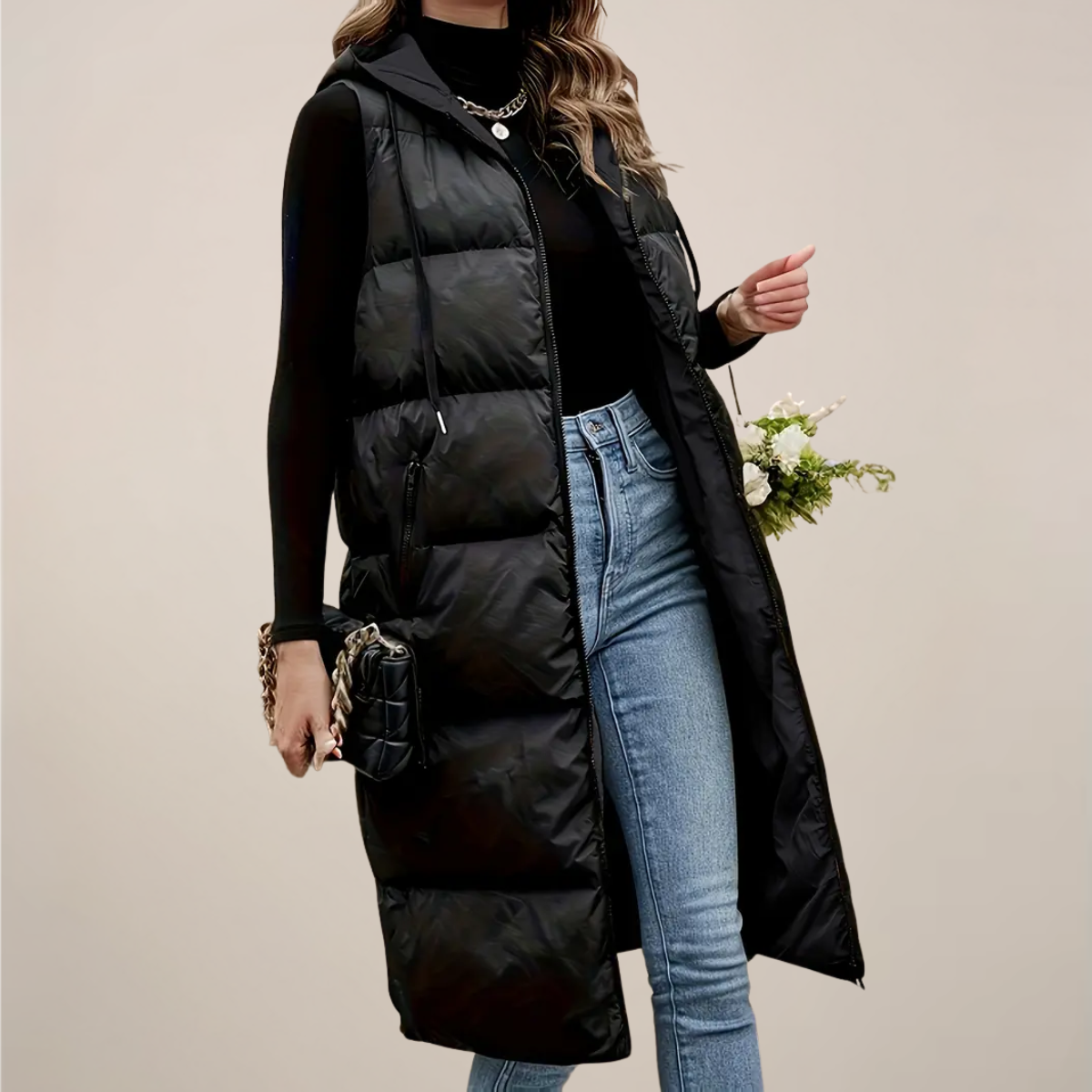 https://cdn.shopify.com/s/files/1/0957/7286/8982/files/Womens-Black-Longline-Puffer-Gilet-Hooded-Zip-Front-Zipped-Pockets-3.png?v=1770237648
