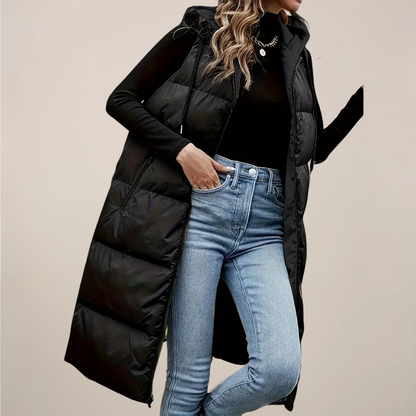 https://cdn.shopify.com/s/files/1/0957/7286/8982/files/Womens-Black-Longline-Puffer-Gilet-Hooded-Zip-Front-Zipped-Pockets-4.png?v=1770237648