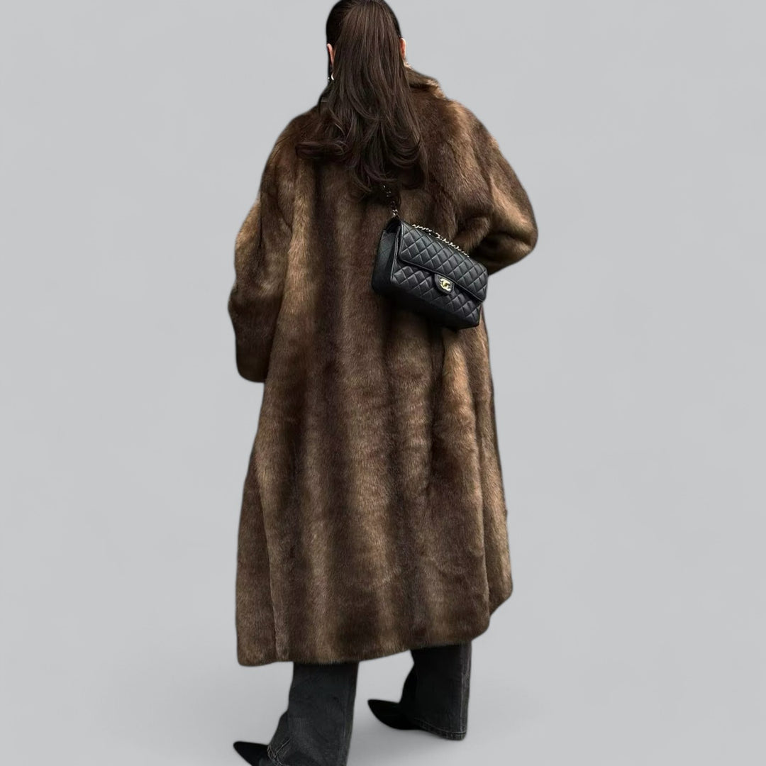 https://cdn.shopify.com/s/files/1/0957/7286/8982/files/Womens-Dark-Brown-Long-Faux-Fur-Trench-Coat-Luxe-Winter-Outerwear-2.jpg?v=1770237645