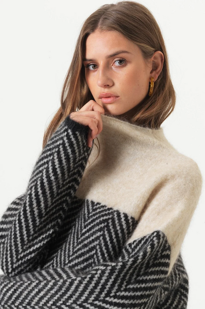 https://cdn.shopify.com/s/files/1/0957/7286/8982/files/Womens-Oversized-Turtleneck-Sweater-Soft-Two-Tone-Knit-with-Chevron-Pattern-2.png?v=1770237693