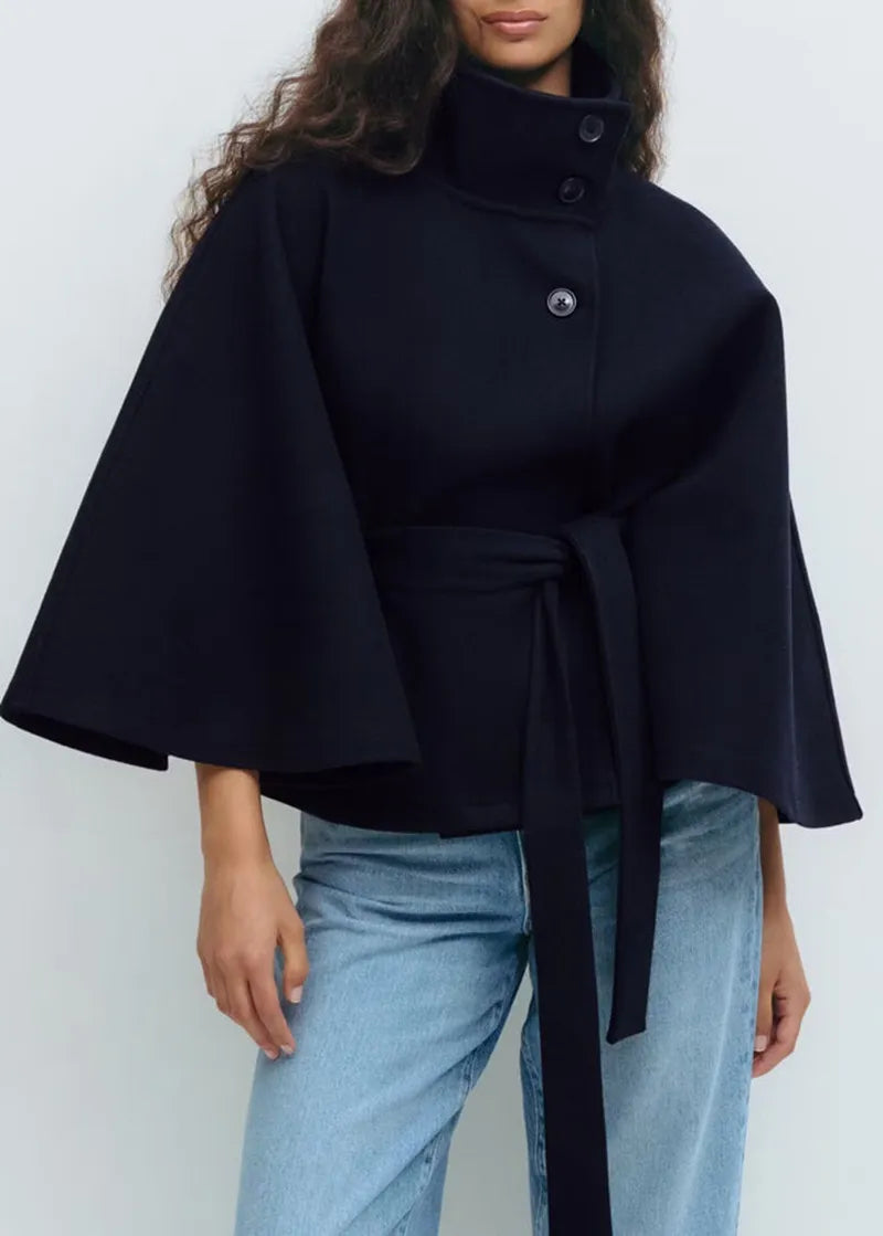 https://cdn.shopify.com/s/files/1/0957/7286/8982/files/Womens-Short-Cape-Coat-Funnel-Neck-Belted-Waist-Cape-Sleeves-3.webp?v=1770237641