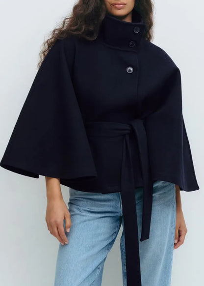https://cdn.shopify.com/s/files/1/0957/7286/8982/files/Womens-Short-Cape-Coat-Funnel-Neck-Belted-Waist-Cape-Sleeves-3.webp?v=1770237641