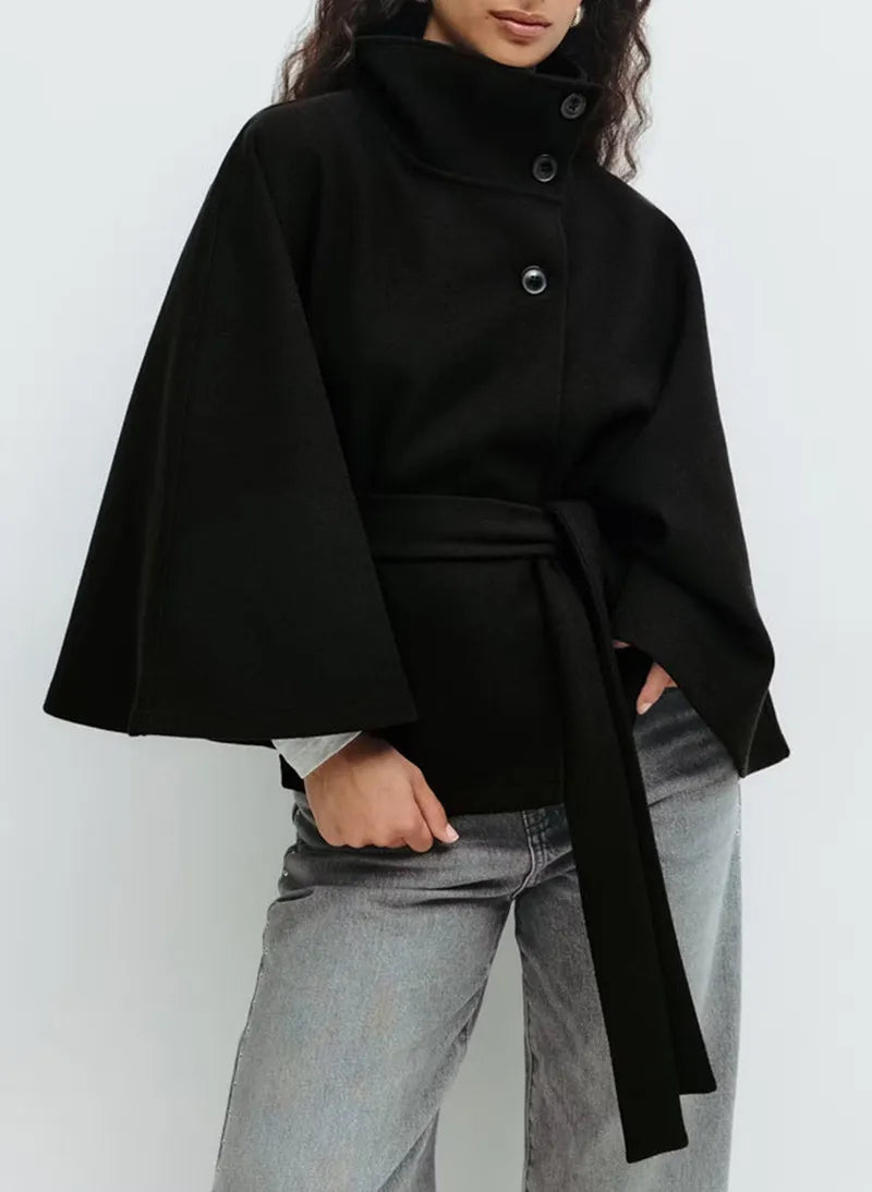 https://cdn.shopify.com/s/files/1/0957/7286/8982/files/Womens-Short-Cape-Coat-Funnel-Neck-Belted-Waist-Cape-Sleeves-6.webp?v=1770237642