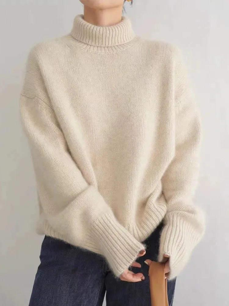 https://cdn.shopify.com/s/files/1/0957/7286/8982/files/Womens-Turtleneck-Sweater-Relaxed-Fit-Ribbed-Neck-Cuffs-2.webp?v=1770237691