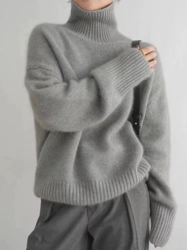 https://cdn.shopify.com/s/files/1/0957/7286/8982/files/Womens-Turtleneck-Sweater-Relaxed-Fit-Ribbed-Neck-Cuffs-3.webp?v=1770237690