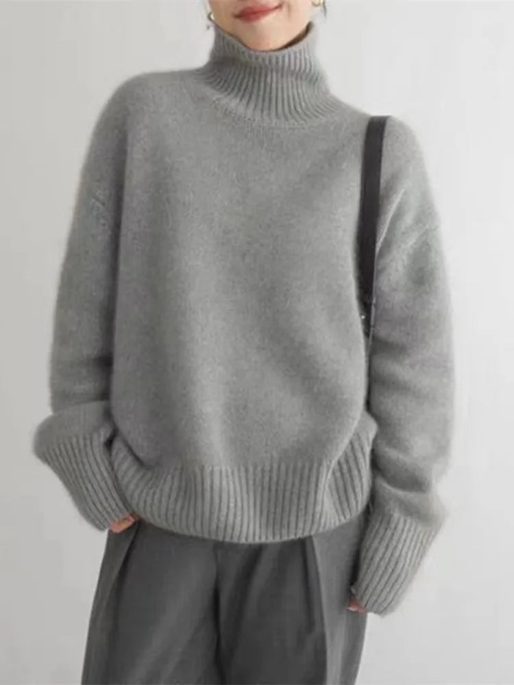 https://cdn.shopify.com/s/files/1/0957/7286/8982/files/Womens-Turtleneck-Sweater-Relaxed-Fit-Ribbed-Neck-Cuffs-4.webp?v=1770237691