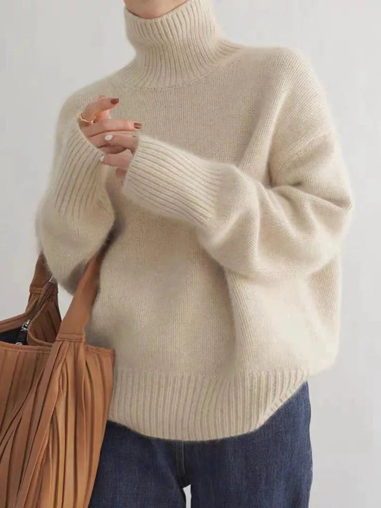 https://cdn.shopify.com/s/files/1/0957/7286/8982/files/Womens-Turtleneck-Sweater-Relaxed-Fit-Ribbed-Neck-Cuffs.webp?v=1770237691