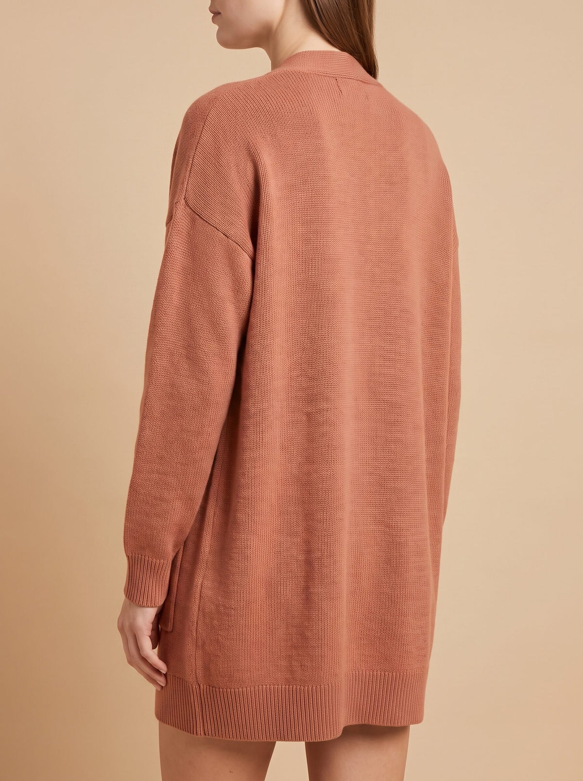 Women's oversized cardigan with pockets in rust, back view