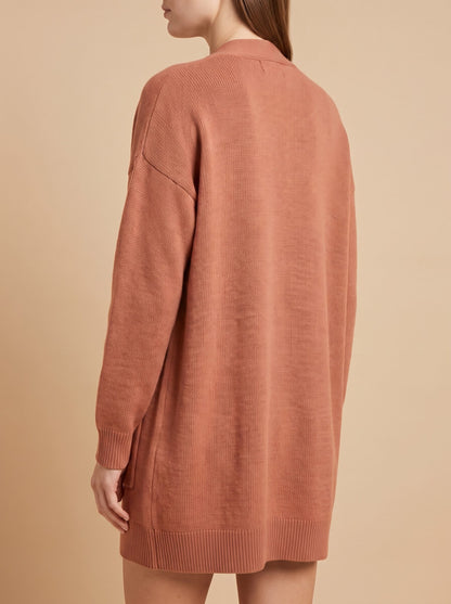 Women's oversized cardigan with pockets in rust, back view