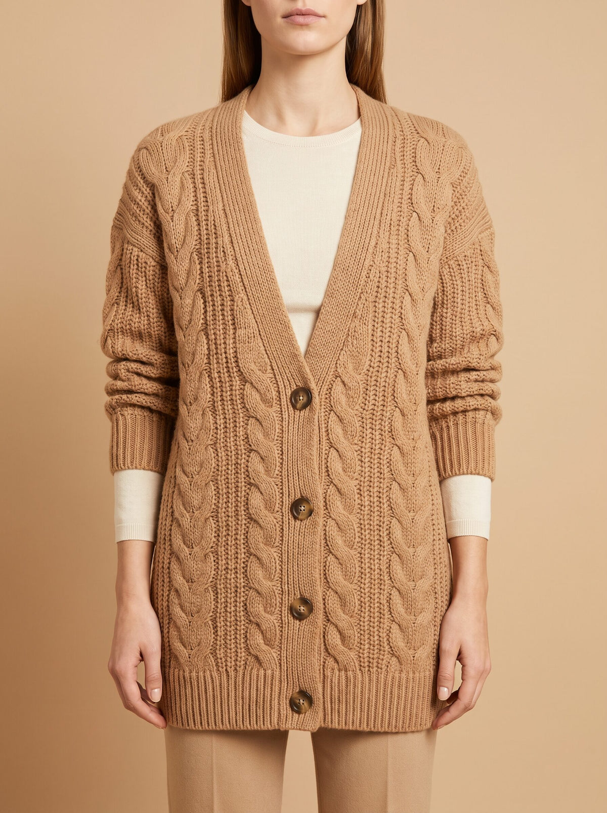 Women's chunky cable knit cardigan in camel, front view